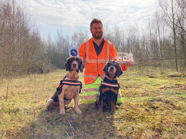 Handler working with a detection dog